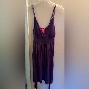 Purple dress. Tie in the front or back. Mid length